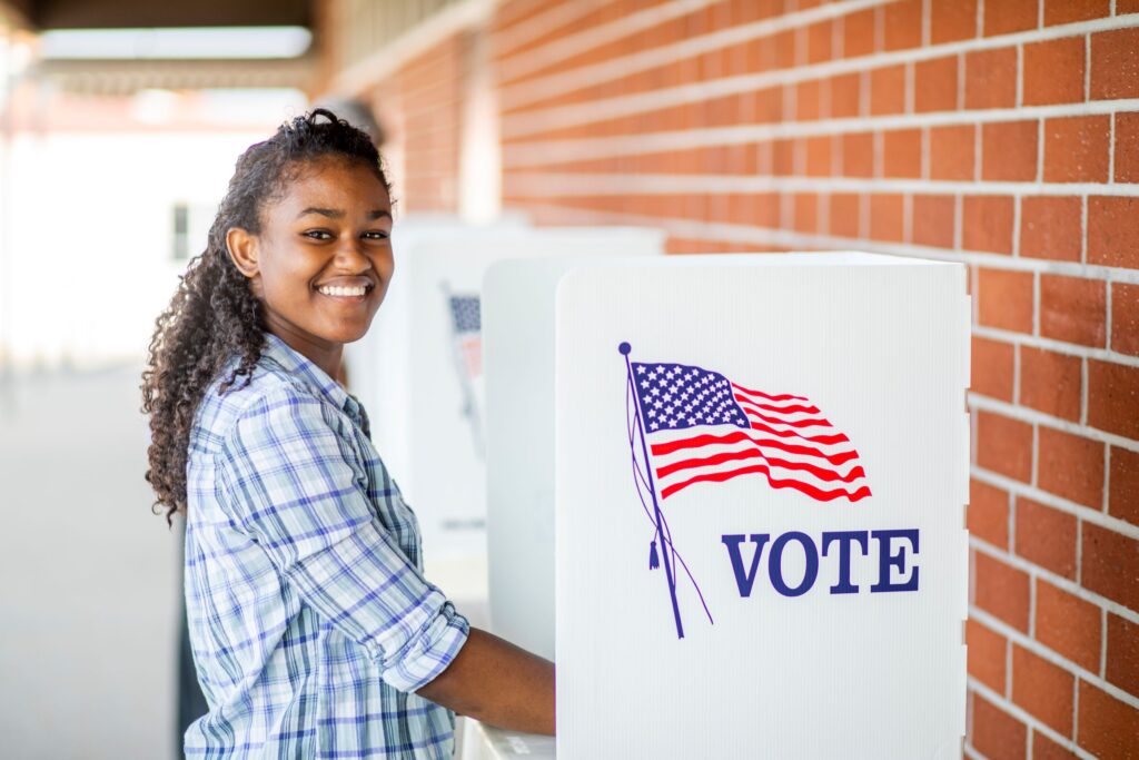 Young woman at a voting booth